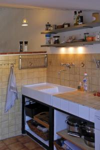 a kitchen with a sink and a counter top at Beautiful townhouse in Bargemon in Bargemon