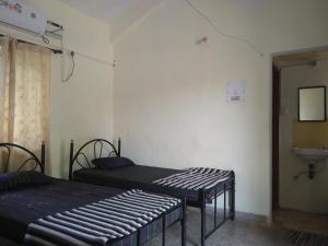 Postel nebo postele na pokoji v ubytování Stay Goa Guesthouse