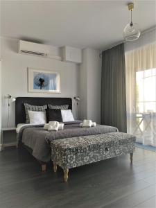 Katil atau katil-katil dalam bilik di Apartamenty Retmana