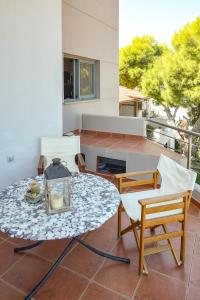 A balcony or terrace at Serenity Villa-1st floor-Sea view- sea 150m away