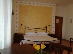 Krevet ili kreveti u jedinici u okviru objekta Hotel Sangallo B&B