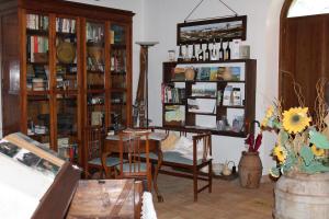 a living room filled with furniture and a table and chairs at agriturismo trefossata in Abbadia San Salvatore