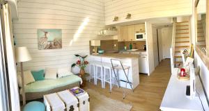 a small kitchen and living room in a tiny house at 18 Rue de la Corvette in Saint-Palais-sur-Mer