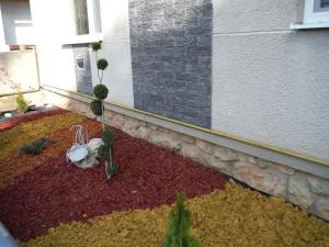 a balcony with a garden with plants in it at Apartman Silver in Zádiel