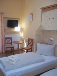 Rúm í herbergi á JUFA Hotel Gitschtal