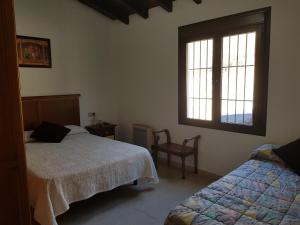Postel nebo postele na pokoji v ubytování Casita la Herilla + 37 fotografií