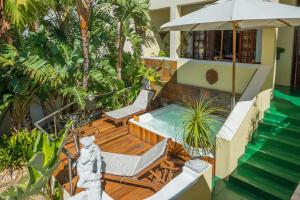 a house with a swimming pool and a patio at Stadium Guest House in Cape Town