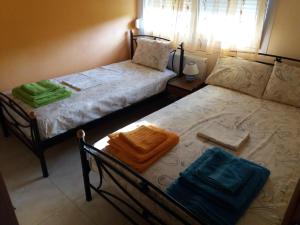 A bed or beds in a room at Dimitrios Apartments