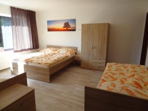 Postel nebo postele na pokoji v ubytování Vila Lom