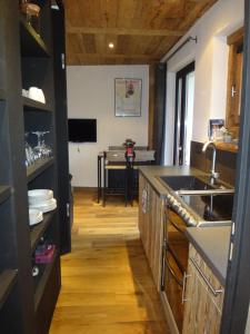 a kitchen with a sink and a counter top at La Petite Suite in Megève