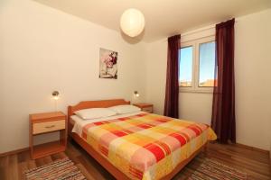 Posteľ alebo postele v izbe v ubytovaní Apartments Slađana