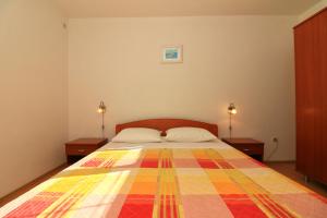 Postel nebo postele na pokoji v ubytování Apartments Slađana