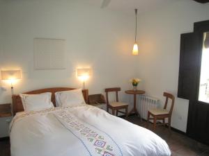 Postel nebo postele na pokoji v ubytování Casa Rural Hosteria Cantarranas