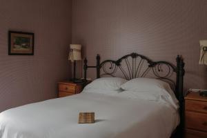 Voodi või voodid majutusasutuse Albergo Allegria Hotel & Breakfast Restaurant toas