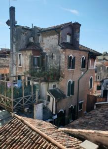 a view of an old building from the roofs at Ca San Luca in Venice