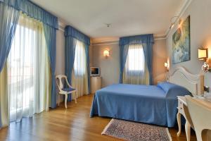 Postel nebo postele na pokoji v ubytování Albergo Da Nando