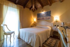 Postel nebo postele na pokoji v ubytování Albergo Da Nando