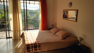 Postel nebo postele na pokoji v ubytování Hotel Faroazul RNT12633