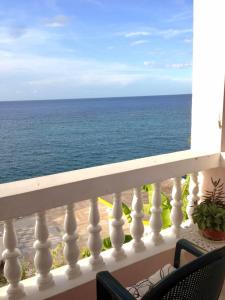 a view of the ocean from a balcony at Ocean Edge Villa in Boscobel