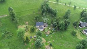 an aerial view of a house in a field at Adventure House (Abenteuerferienhaus) in Rechenberg-Bienenmühle