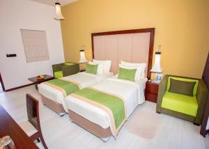 Amora Lagoon Hotel客房内的一张或多张床位