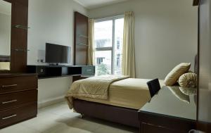 TV a/nebo společenská místnost v ubytování Bendungan Hilir Residence