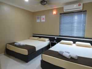 Ένα ή περισσότερα κρεβάτια σε δωμάτιο στο Gm Motel