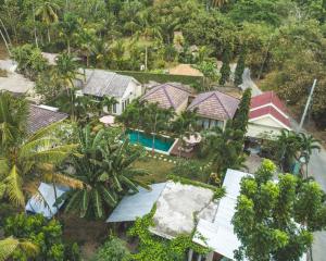 an aerial view of a house with a swimming pool at Shu Villa Lombok in Kuta Lombok