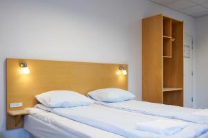 Postel nebo postele na pokoji v ubytování BB-Hotel Vejle Park