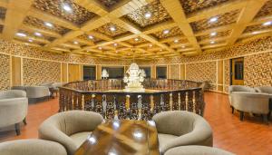 a large room with chairs and a table in it at Royal Grandiose Pahalgam in Pahalgām