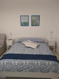 Postel nebo postele na pokoji v ubytování Enjoy Trani