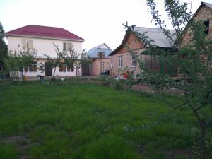a yard in front of a house at Talants Guest House in Bishkek