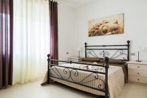 Tempat tidur dalam kamar di Villa Rosina