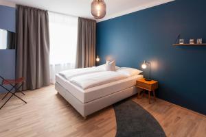 Postel nebo postele na pokoji v ubytování URBANAUTS FLATS Cubierta