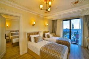 Ein Bett oder Betten in einem Zimmer der Unterkunft Yılsam Sultanahmet Hotel