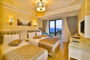 A bed or beds in a room at Yılsam Sultanahmet Hotel