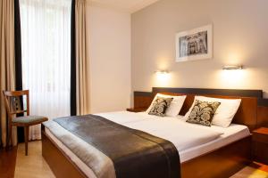 Posteľ alebo postele v izbe v ubytovaní Hapimag Resort Budapest