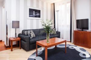 Televízia a/alebo spoločenská miestnosť v ubytovaní Hapimag Resort Budapest