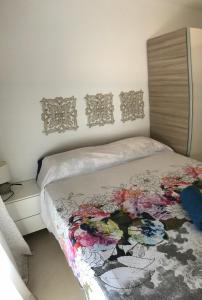 Postel nebo postele na pokoji v ubytování Appartamento Erika