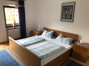 Säng eller sängar i ett rum på Zum waldfrieden