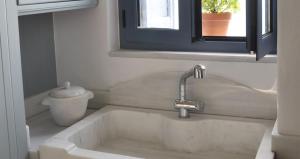 a sink in a bathroom with a sink at Villa Kardiani in Kardhianí +21 photos