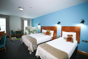 Rúm í herbergi á Treacys Hotel & Leisure Centre Waterford
