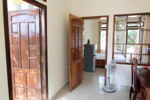 a room with an open door and a refrigerator at Moon house tropical garden - West side in Nha Trang +13 photos