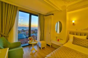 Ein Bett oder Betten in einem Zimmer der Unterkunft Yılsam Sultanahmet Hotel