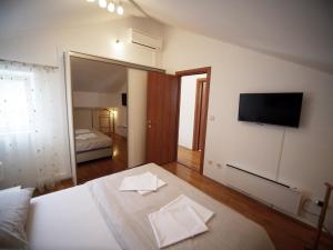 Ένα ή περισσότερα κρεβάτια σε δωμάτιο στο Apartment Dora