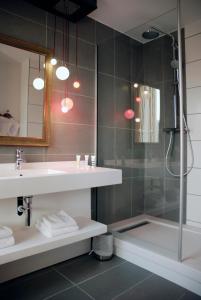 a bathroom with a sink and a shower at Mercure Lyon Centre - Gare Part Dieu in Lyon