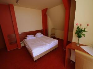 Posteľ alebo postele v izbe v ubytovaní Hotel Rydzewski