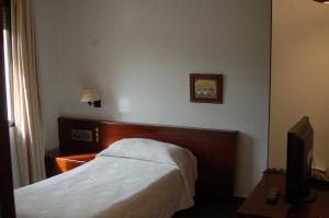 Hotel Betriu tesisinde bir odada yatak veya yataklar