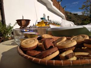 a plate of cookies and biscuits on a table at VILLA ZEN TAORMINA in Taormina