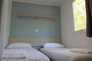 Cama o camas de una habitación en Camping La Fundicion